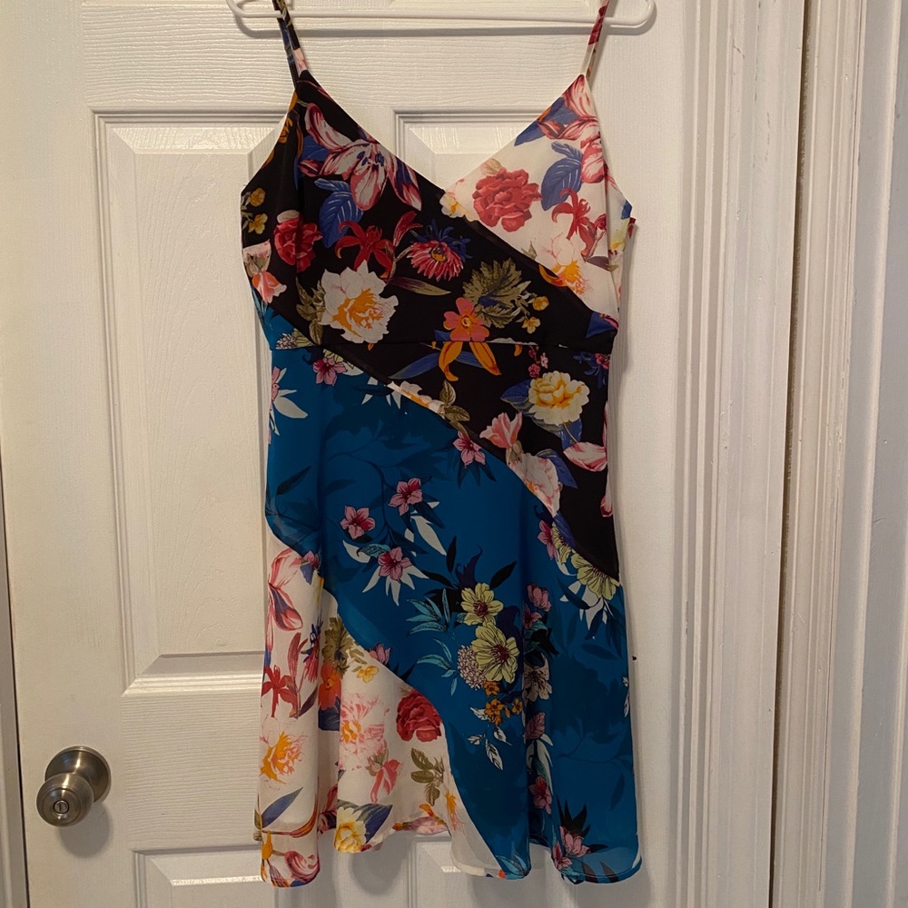 Knee length spaghetti strap party dress.